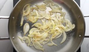 Thinly sliced onions, gently sizzling in a hot pan